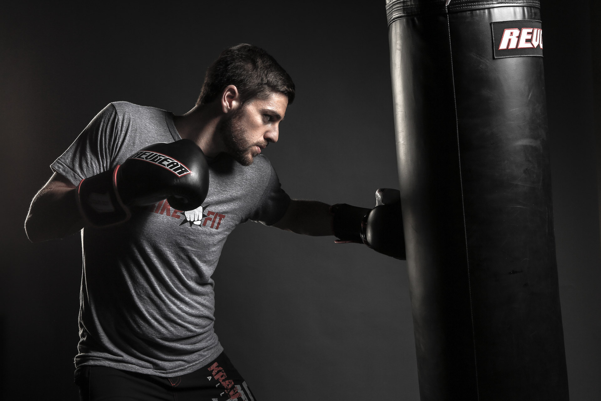 StrikeFit athlete practicing punches on a heavy bag