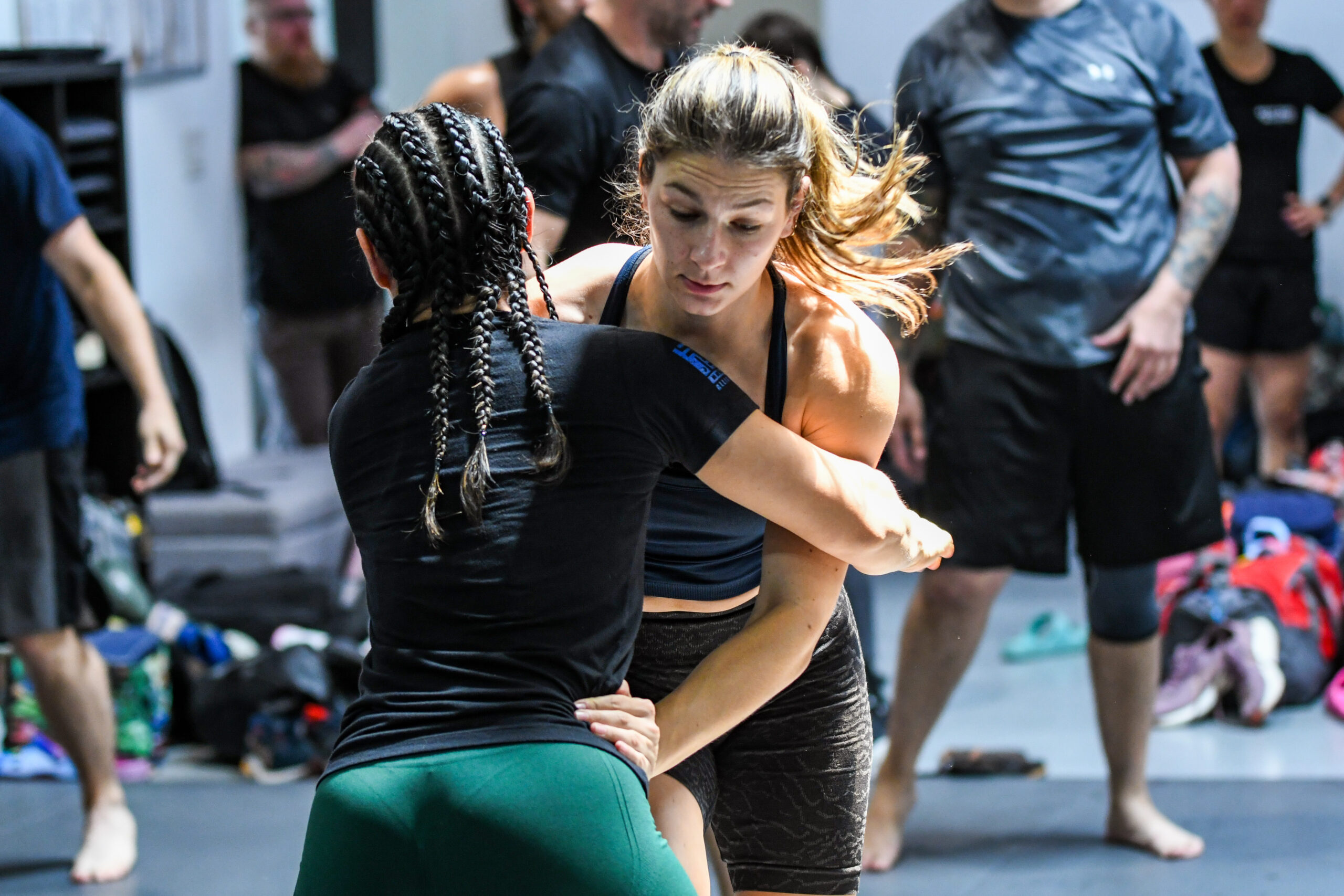 Two Alliance participants practicing a standing partner drill